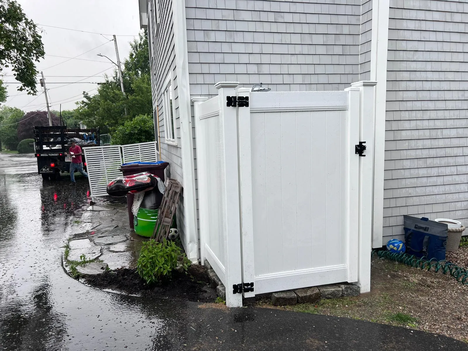 Outdoor shower with privacy fence